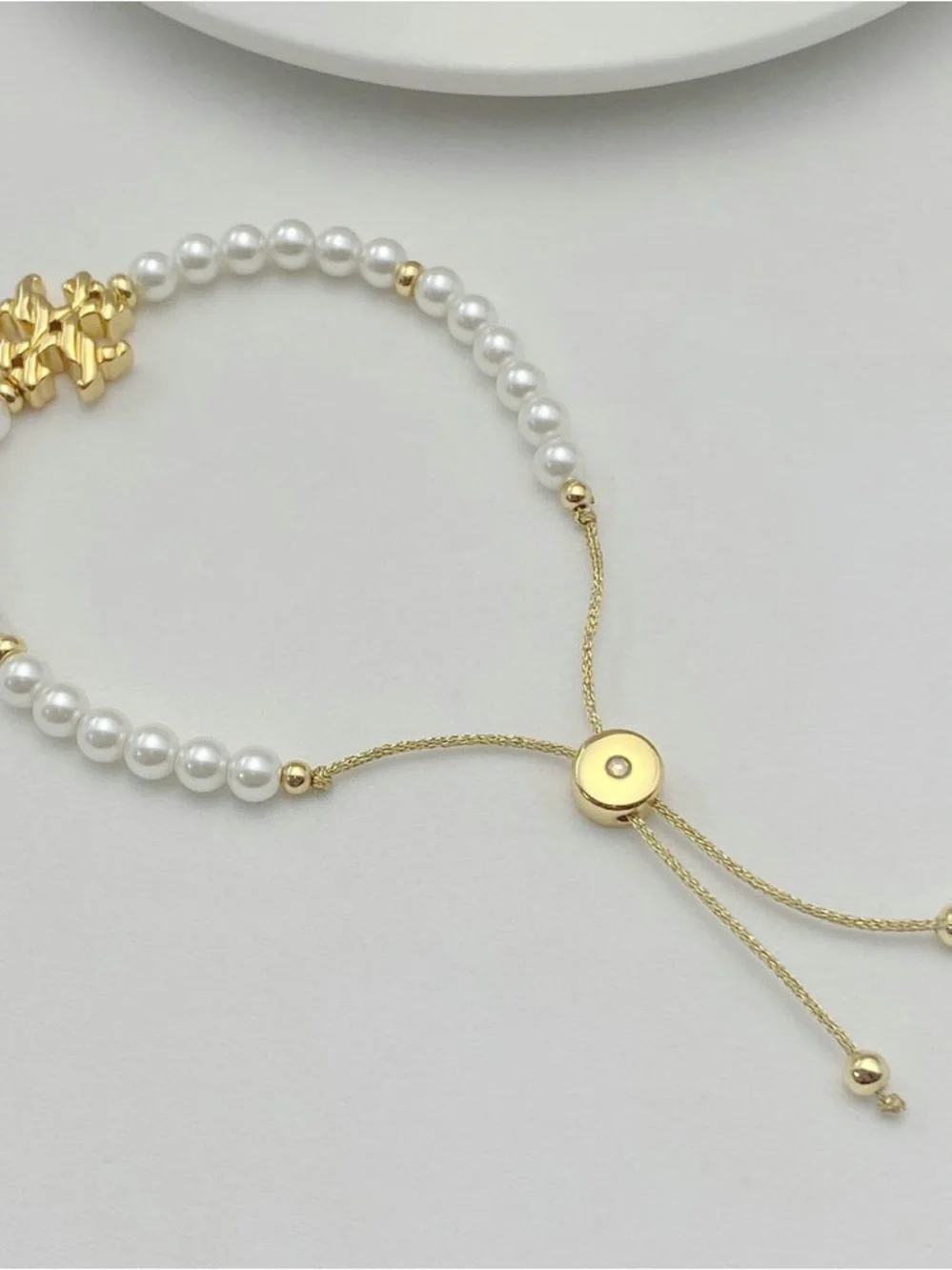 Tory Burch Gold and White Pearl Logo Adjustable Bracelet